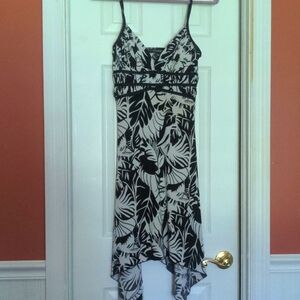 Spaghetti shoulder straps and handkerchief hem.